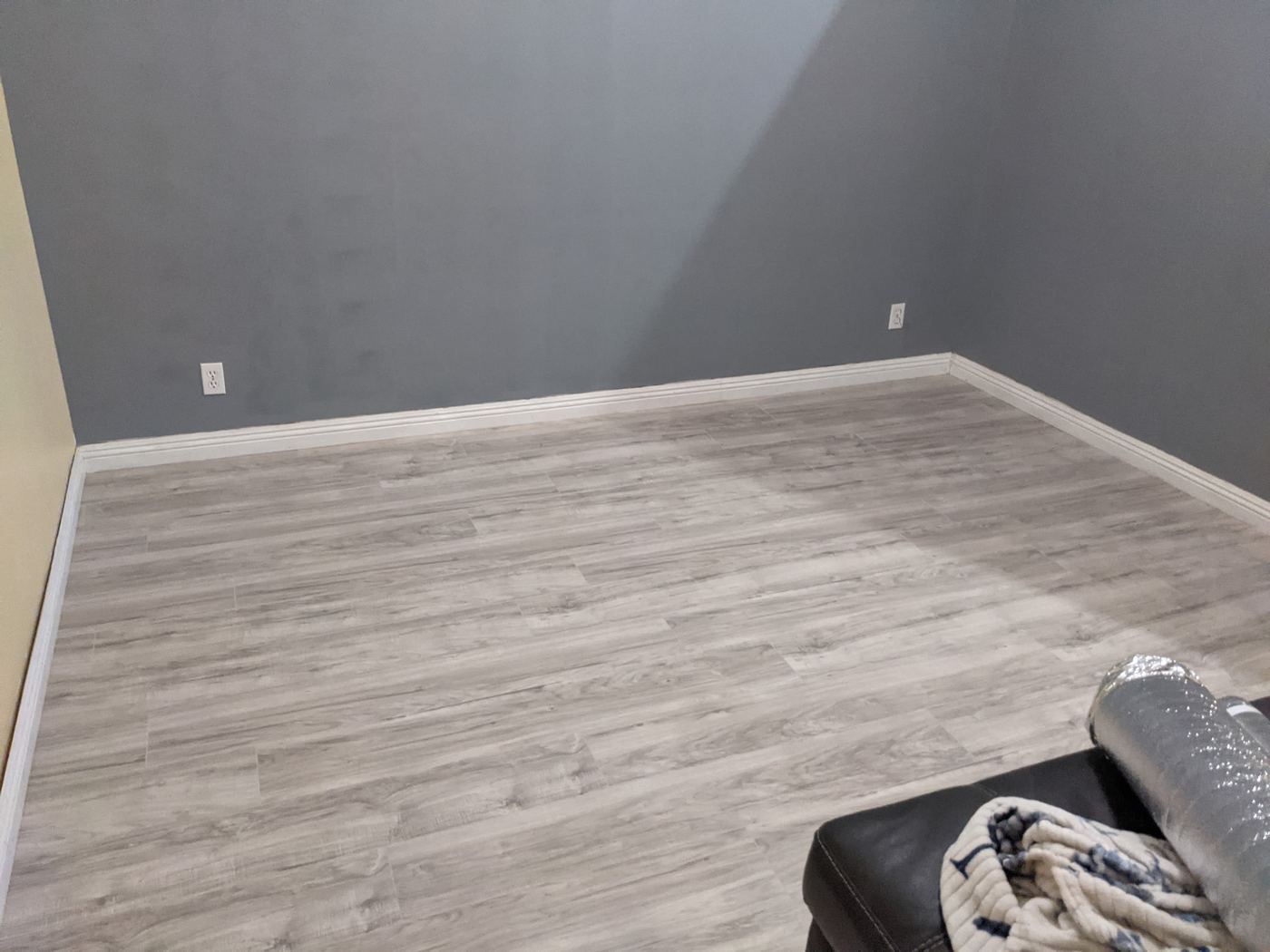 Finished plank flooring, corner detail