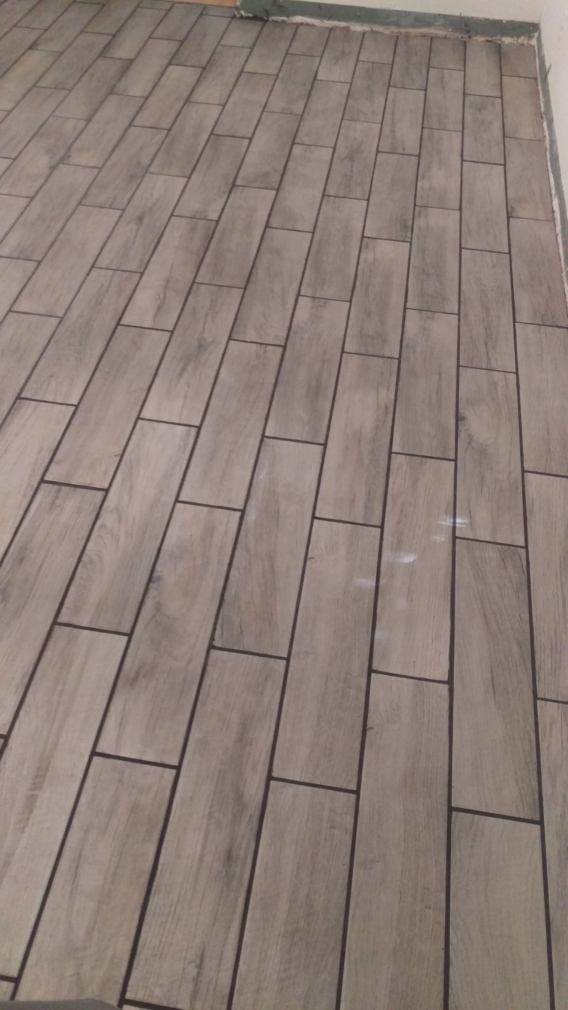 Finished tile flooring