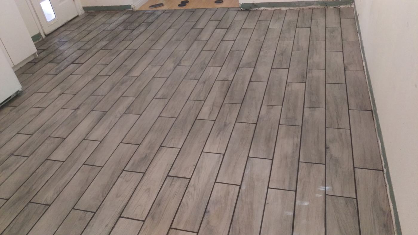 Finished tile flooring by the doorway