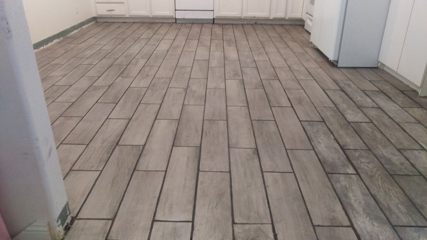 Finished tile flooring, kitchen view